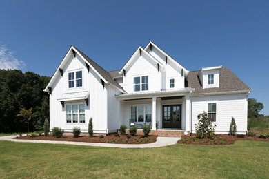 Example of a two-story house exterior design in Other