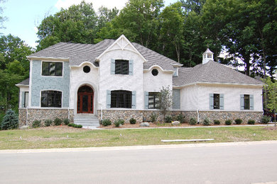 Mid-sized traditional white two-story brick exterior home idea in Indianapolis