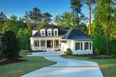 Large and white traditional two floor brick house exterior in Atlanta.