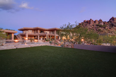 Photo of an expansive modern two floor concrete house exterior in Phoenix.