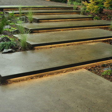 Cantilevered concrete stairs w/ lighting underneath
