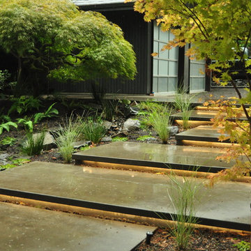 Cantilevered concrete stairs w/ lighting underneath