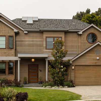 Transitional brown two-story wood exterior home photo in Los Angeles with a shingle roof