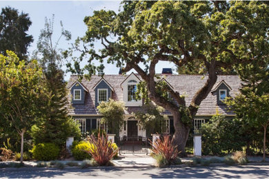 Inspiration for a country two-story house exterior remodel in San Francisco with a shingle roof