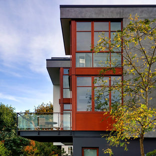 Idee per la facciata di una casa contemporanea con rivestimento in cemento