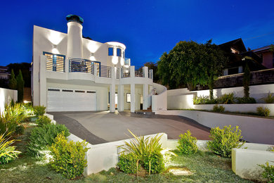 Inspiration for a large modern white two-story stucco exterior home remodel in San Diego