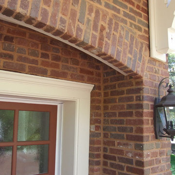 Carriage House Garage Doors with brick arches.