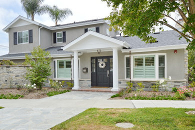 Traditional gray two-story mixed siding exterior home idea in Los Angeles with a shingle roof