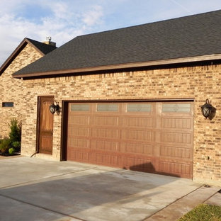 Inspiration for a mid-sized rustic beige two-story brick exterior home remodel in Houston with a hip roof