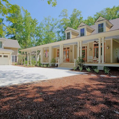 Large elegant beige two-story wood gable roof photo in Atlanta