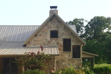 Example of a farmhouse exterior home design in Houston