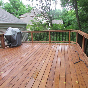 Cedar toned pressure treated deck with aluminum balusters 2