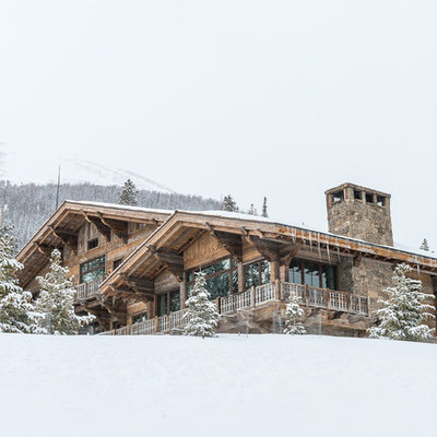 Inspiration for a rustic brown two-story mixed siding exterior home remodel in Other
