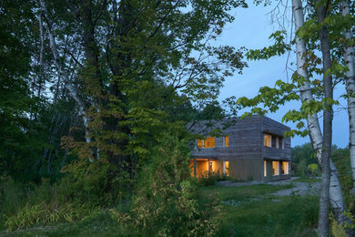 Example of a mid-sized minimalist two-story exterior home design in Burlington