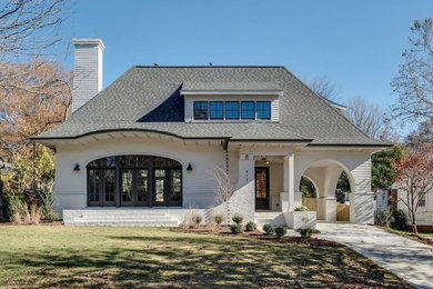 Example of a farmhouse exterior home design in Charlotte