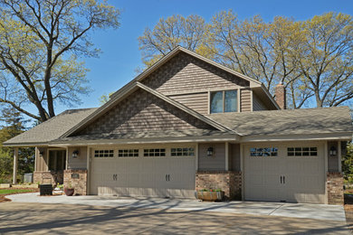 Inspiration for a mid-sized craftsman brown two-story metal exterior home remodel in Minneapolis with a shingle roof