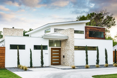 Inspiration for a modern white one-story stucco exterior home remodel in Dallas