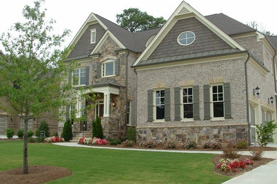 Inspiration for a timeless gray two-story brick exterior home remodel in Atlanta