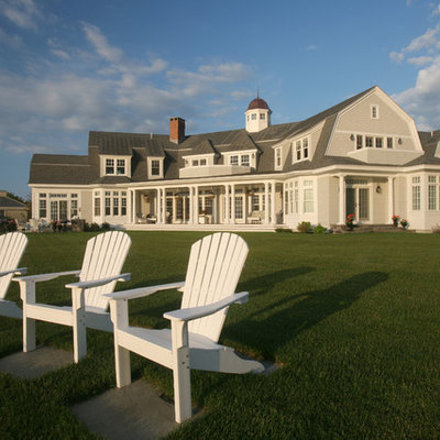 Large ornate two-story wood exterior home photo in Boston