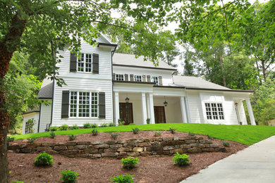Inspiration for a large and white farmhouse two floor house exterior in Atlanta.