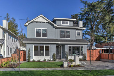 Large transitional blue two-story mixed siding house exterior photo in San Francisco with a hip roof and a shingle roof