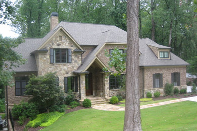 Large traditional two-story mixed siding house exterior idea in Atlanta with a hip roof and a shingle roof
