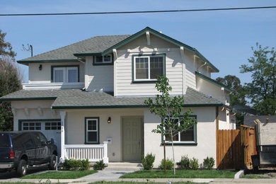 Inspiration for a mid-sized timeless white two-story mixed siding gable roof remodel in San Francisco