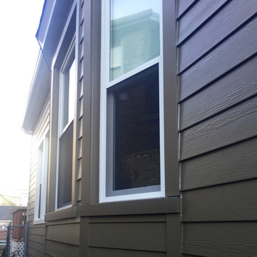Chicago, IL Bungalow Siding Replacement with Dark Brown Siding