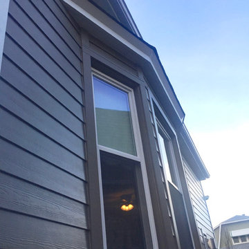 Chicago, IL Bungalow Siding Replacement with Dark Brown Siding