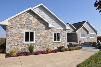 Example of a gray one-story stone exterior home design in Wichita