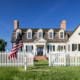 Example of a large classic white two-story concrete fiberboard house exterior design in Philadelphia with a gambrel roof and a shingle roof