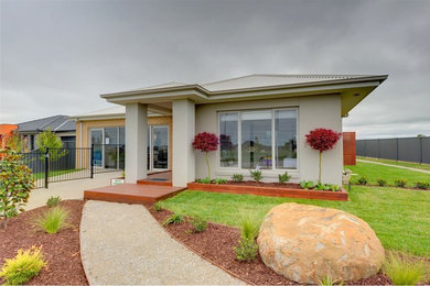 Photo of a gey contemporary bungalow house exterior in Melbourne with mixed cladding.