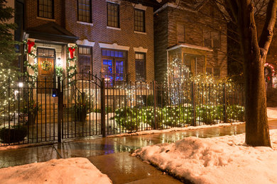 Example of a mid-sized classic brick townhouse exterior design in Chicago