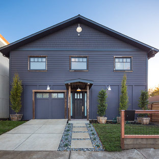 Large industrial purple two-story wood gable roof idea in San Francisco