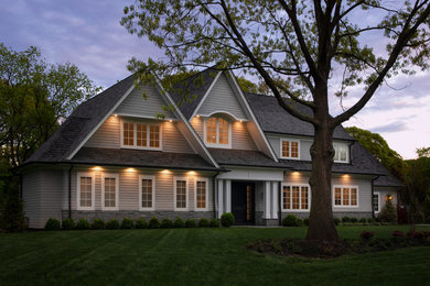 Inspiration for a mid-sized coastal gray two-story mixed siding exterior home remodel in Other with a shingle roof