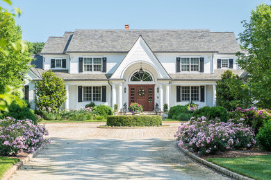 Inspiration for a timeless white two-story gable roof remodel in New York