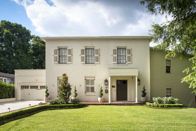 Example of a classic beige two-story exterior home design in New Orleans