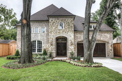 Inspiration for a mid-sized timeless two-story brick exterior home remodel in Houston
