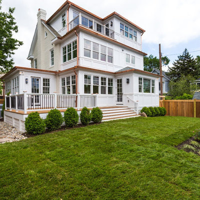 Mid-sized elegant white three-story brick gable roof photo in DC Metro