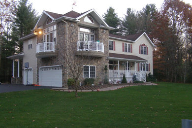 Large elegant beige two-story mixed siding exterior home photo in Boston with a shingle roof