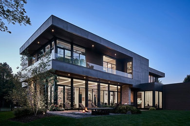 Inspiration for a large modern gray two-story metal exterior home remodel in Chicago