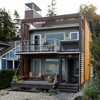 Mid-sized trendy multicolored two-story mixed siding house exterior photo in Seattle with a shed roof and a metal roof