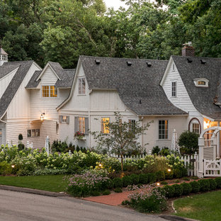 Traditional white two-story exterior home idea in Minneapolis with a shingle roof