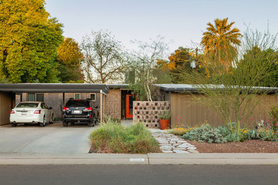Example of a mid-sized 1950s exterior home design in Phoenix