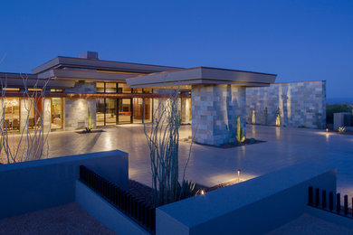 Photo of a contemporary house exterior in Phoenix with a flat roof.