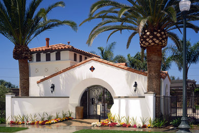 Mid-sized mediterranean two-story stucco gable roof idea in San Diego