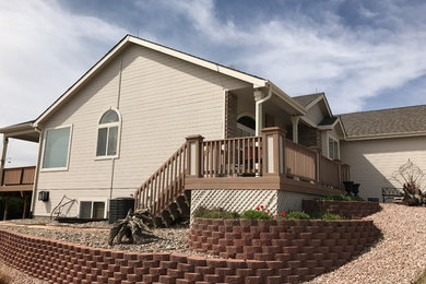 This is an example of a medium sized and beige classic bungalow detached house in Denver with wood cladding, a pitched roof and a shingle roof.