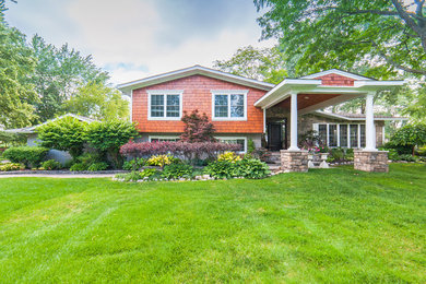 Inspiration for a mid-sized rustic brown one-story wood exterior home remodel in Detroit with a shingle roof