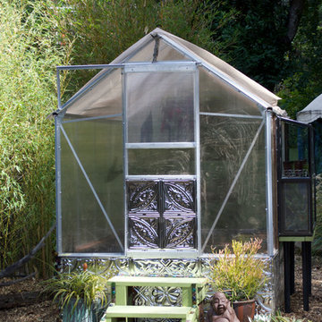 Compact Backyard Greenhouse With Stamped Metal Ceiling Tile Foundation