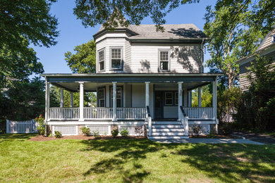 Mid-sized victorian gray two-story wood exterior home idea in New York with a shingle roof